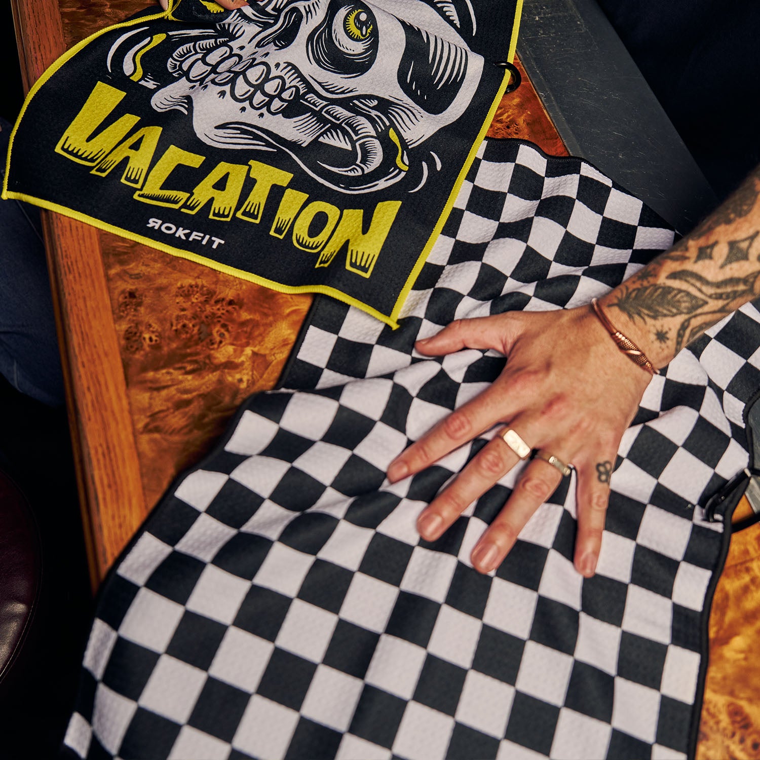 Male model using Utility Towel on bar top with 'Checker' graphic