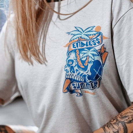 Female model wearing unisex Active Tee showing close up of the front view with 'Endless Summer' graphic